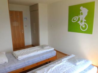 Single Bed in Dormitory Room with Shared Bathroom